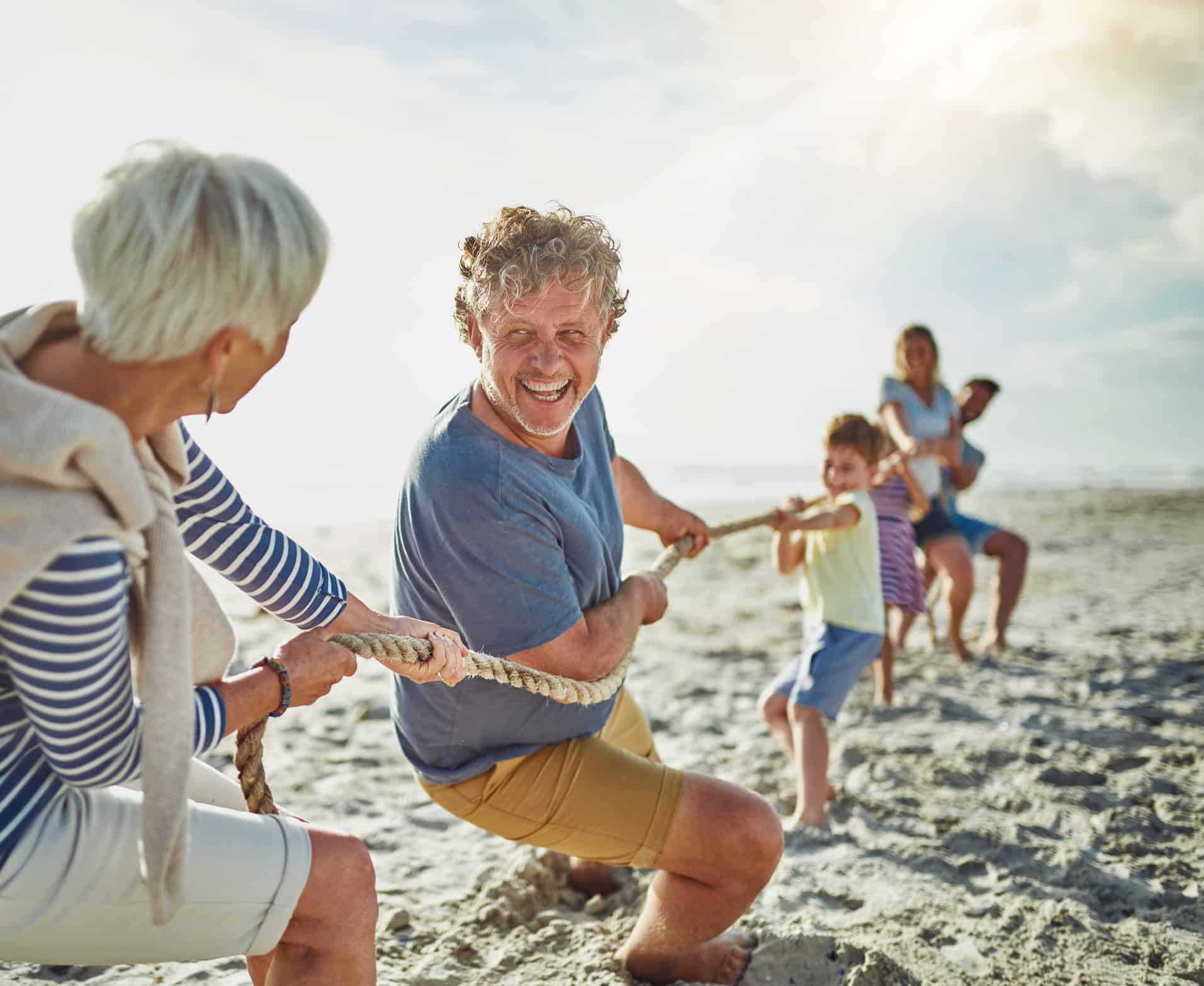 family playing tug of war