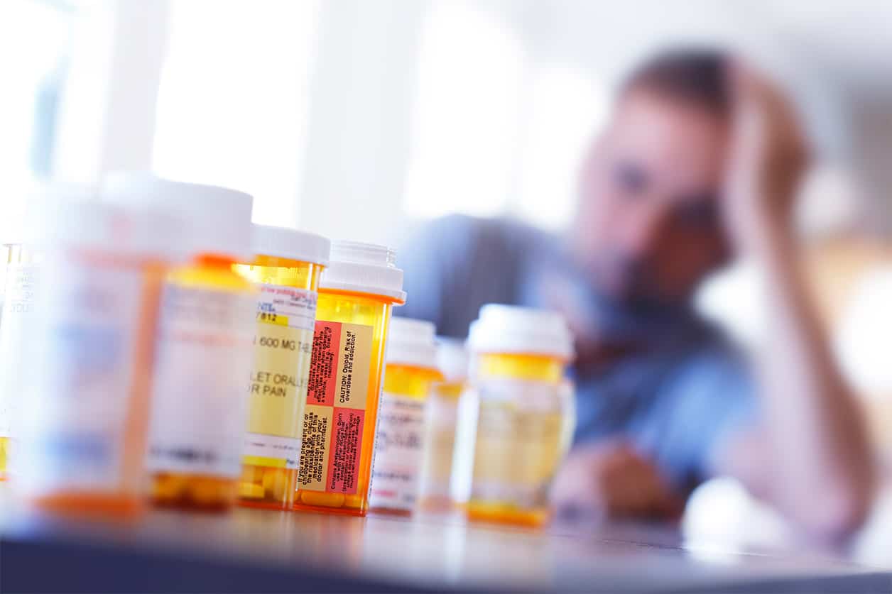 Picture of a lot of prescription medications (pill bottles)