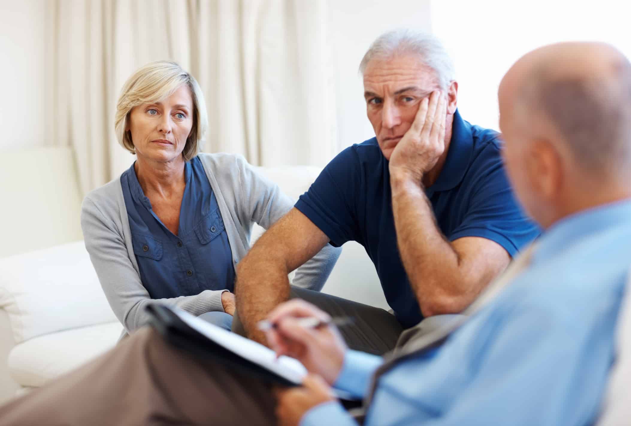 Tense senior couple meeting with their counsellor.